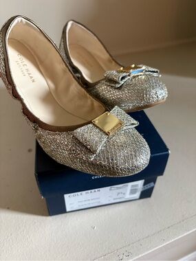 NWT Cole Haan Tali Metallic Gold Bow Flats, size 7.5